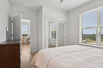 Spacious bedrooms with double closet doors and full-length mirrored panels